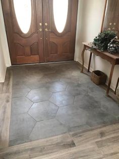 home entryway tile design Tile And Wood Front Entrance, Tiles Mixed With Wood Floor, Tile Entrance To Wood, Breezeway Tile Floor, Foyer Tile Ideas Entryway Hexagon, Tile Kitchen To Wood Living Room, Tiled House Flooring, Farmhouse Foyer Tile Floor, Tile With Hardwood Floors