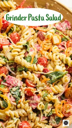 a bowl filled with pasta salad and the words grinder pasta salad above it on top