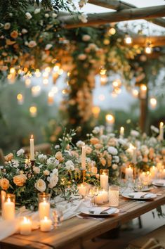 flowers and candles decorate a lush outdoor wedding space Romantic Candle Light Wedding, Flower Decorating Ideas, Candle Light Wedding, Taper Candles Wedding, Floral Arches, Weddings Beach, Floating Candle Centerpieces, Aisle Runners, Romantic Candlelight