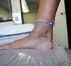 a person with a tattoo on their foot