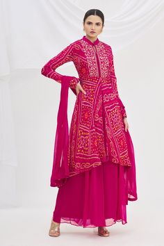 Magenta asymmetric kurta with Bandhani print and embroidered bodice. Paired with palazzo and dupatta.
Component: 3
Printed
Neckline: Mandarin
Sleeve Length: Full
Fabric: Georgette
Color: Pink
Embroidered bodice
Back cutout - Aza Fashions Bandhani Lehenga, Asymmetric Kurta, Bandhani Print, Bandhani Dress, Kurta Set For Women, Kurti Designs Latest, Embroidered Bodice, Stylish Party Dresses, Dress Indian Style