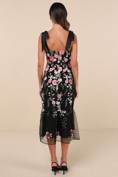 From casually chic cocktails to exceptional occasions, we can't get enough of the Lulus Stunning Inclination Black Embroidered Tie-Strap Midi Dress! Lightweight woven fabric shapes tying shoulder straps that support a mesh bodice with allover floral embroidery, a straight neckline, and flattering seaming. Fitted waist tops a figure-skimming trumpet skirt that features matching embroidery as it falls to a tiered midi hem. Hidden zipper/clasp at back. Fit: This garment fits true to size. Length: Mid-calf length. Size medium measures 42.50" from adjustable straps to hem. Bust: Works best for A to C cup sizes - consider sizing up for fuller bust. Waist: Fitted - very fitted at natural waist. Hip: Fitted - consider sizing up for fuller hips. Undergarments: May be worn with a strapless bra, adhe Floral Dress Wedding Guest, Matching Embroidery, Wedding Guest Dress Midi, Fall Fashion Skirts, Casually Chic, Embroidered Tie, Black Embroidered Dress, Trumpet Dress, Trumpet Skirt