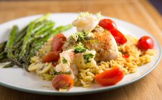 a white plate topped with rice and veggies