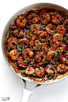 the dish is prepared and ready to be eaten with sesame seeds on top, garnished with green leaves