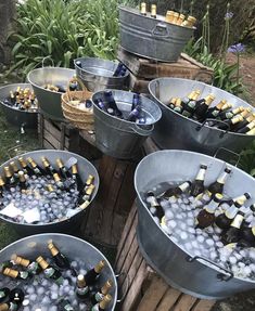 several buckets filled with bottles of beer