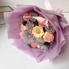 a bouquet of flowers sitting on top of a table