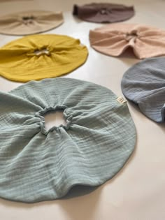 several different colored hair ties laid out on a table