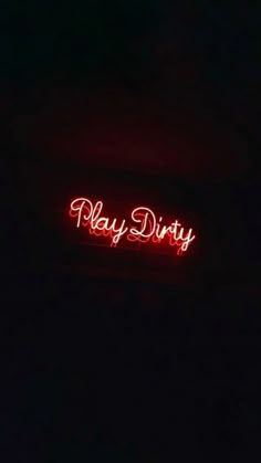 a red neon sign that says play dirty