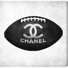 a black and white photo of a football with the word chanel on it