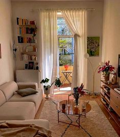 a living room filled with furniture and a flat screen tv