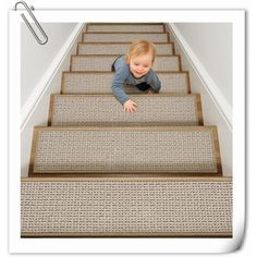 a toddler crawling down the stairs with his feet on the carpet