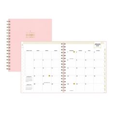 a pink planner with gold foil on the cover and an open spiral bound notebook in front