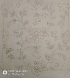 a drawing of flowers and leaves on a sheet of paper