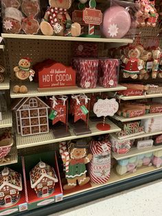 a display in a store filled with lots of different types of cookies and candies