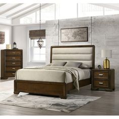 a bedroom with a bed, night stand and two nightstands in brown wood finish