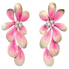 Introducing the charming DAISY FLOWER PINK EARRINGS, a delightful addition to any jewelry collection. Crafted with white gold, these earrings feature enchanting daisy flower motifs adorned with round brilliant cut diamonds, delicately set amidst pink and white enamel petals. Key Specifications: Weight: These earrings weigh a total of 28.95 grams, providing a substantial yet comfortable feel when worn. Net Metals grams: Crafted with 28.69 grams of premium white gold, ensuring durability and lasting beauty. Diamond and Brilliant: Embellished with 1.30 carats of sparkling round brilliant cut diamonds, adding a touch of brilliance and sophistication to the design. These earrings are a whimsical and feminine accessory, perfect for adding a touch of elegance to any ensemble. The combination of d Dope Tattoos For Women, Flower Motifs, Flower Earring, Jewelry Flower, Pink Earrings, White Enamel, Daisy Flower, Round Brilliant Cut Diamond, Flower Earrings