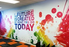 an office wall that has been painted with the words, future is created by what you do today