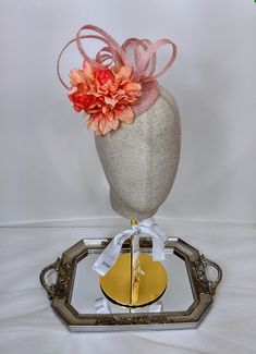 100% Sinamay straw peach and orange fascinator hat adorned with beautiful arrangement of flowers, and sinamay loops. This mini peach orange fascinator would look great with a summer tea party dress. It can be worn to a wedding as wedding guest headpiece or for mother of the bride headpiece or mother of the groom hair accessory. Imagine wearing this gorgeous orange mini hat as your Kentucky Derby hat.   Diameter of peach fascinator / coral fascinator/ orange fascinator hair accessory = 5 inches or 12.5 cm Wear this peach and orange flower  fascinator as any special occasion fascinator, special occasion hat, wedding fascinator, bridal shower fascinator, tea party fascinator, Church fascinator, Kentucky Derby fascinator, Royal Ascot fascinator, Queen's Plate fascinator, race day hat or fashio Adjustable Mini Hats For Spring Ceremonies, Spring Flower Fascinator For Formal Occasions, Spring Formal Fascinator With Handmade Flowers, Spring Formal Flower Fascinator, Spring Formal Flower-shaped Fascinator, Spring Adjustable Fascinator With Handmade Flowers, Orange Mini Hat For Kentucky Derby Races, Elegant Orange Summer Headpiece, Orange Fascinator For Kentucky Derby Races