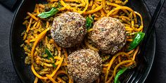 meatballs and spaghetti in a skillet on a table