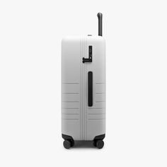 a white piece of luggage on wheels with black handles and handle, against a white background