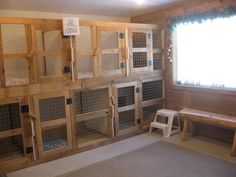 a room that has some kind of animal cages on the wall and in the floor