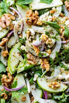 a salad with cucumbers, onions and walnuts