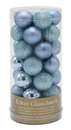 a canister filled with blue and silver christmas bauble ornament balls