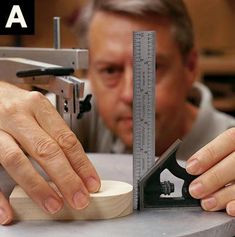 a man is using a measuring tool to measure something