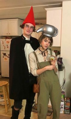 a man and woman dressed up in costumes