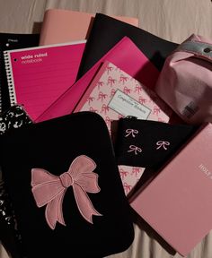 many different types of notebooks with bows on them