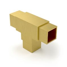 an object made out of gold metal on a white background