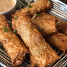 some fried food on a plate with dipping sauce