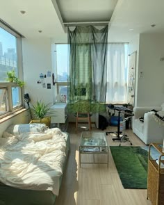 a living room filled with furniture and lots of windows next to a window sill