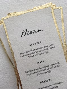 a menu with gold foil on it