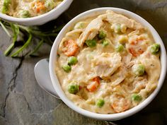 two white bowls filled with chicken pot pie