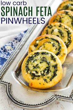 spinach bread rolls on a silver tray