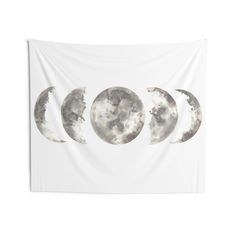 three phases of the moon on a white wall hanging in front of a white background