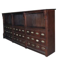 an old wooden cabinet with many drawers