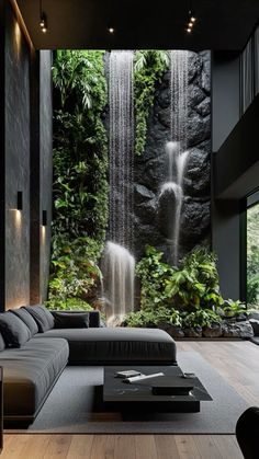 a living room with a large waterfall in the background