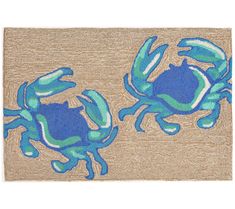 two blue crab rugs sitting next to each other