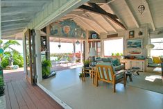 the inside of a house with lots of furniture and decor on it's walls