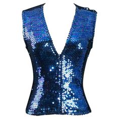 Chantal Thomass - Sleeveless vest entirely covered with blue sequins. No composition or size tag, it fits a size 36FR. Additional information: Dimensions: Bust: 40 cm (15.74") Waist: 32 cm (12.59") Length: 48 cm (18.89") Condition: Very good condition Seller Ref number: FH115 Luxury Sleeveless Blue Outerwear, Fitted Blue Sequin Fabric With Contrast, Vintage Blue Sleeveless Vest, Luxury Blue Sequined Outerwear, Vintage Sleeveless Sequin Top, 1980s Jacket, Applique Jacket, Sequin Vest, Vest Outfits For Women