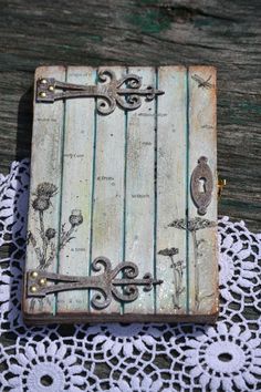 an old wooden box sitting on top of a doily