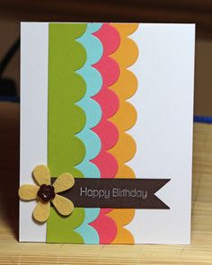 a colorful birthday card with a flower on it