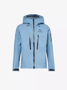 a light blue jacket with hood and zippers