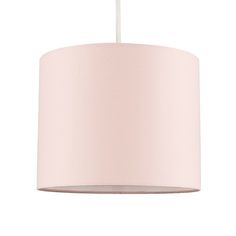 a pink lamp shade hanging from a ceiling