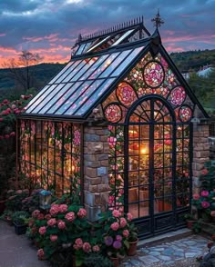 a small building with lots of flowers around it