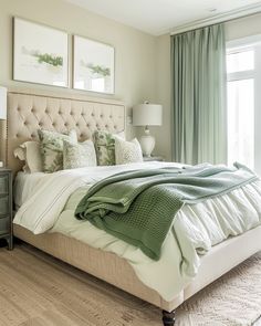 a bedroom with a large bed and green curtains