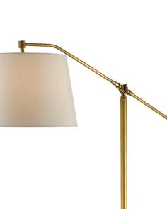 a lamp that has a white shade on it and is next to a light fixture