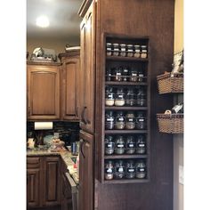 a kitchen filled with lots of wooden cabinets